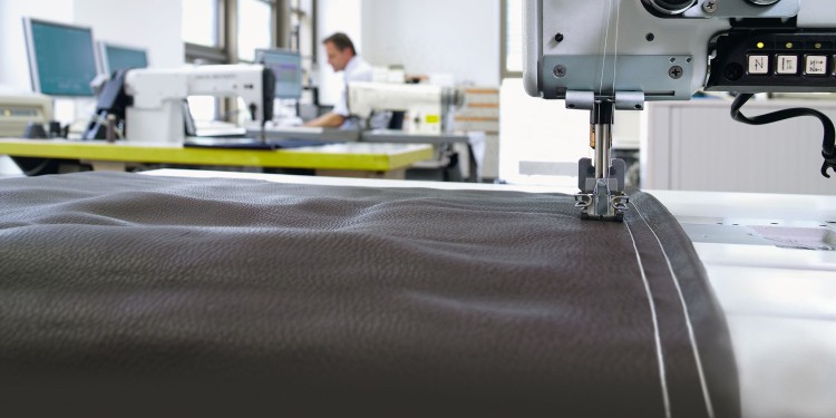 Sewing laboratory with focus on a sewing machine and seam